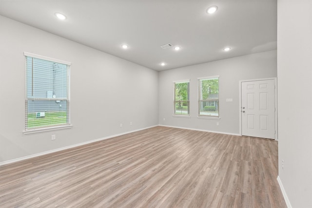705 Little River Dr, Montgomery, TX 77316 - empty room with light wood-style floors, baseboards, and recessed lighting