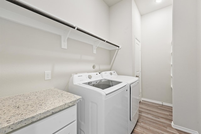705 Little River Dr, Montgomery, TX 77316 - washroom featuring independent washer and dryer, light wood-type flooring, and baseboards