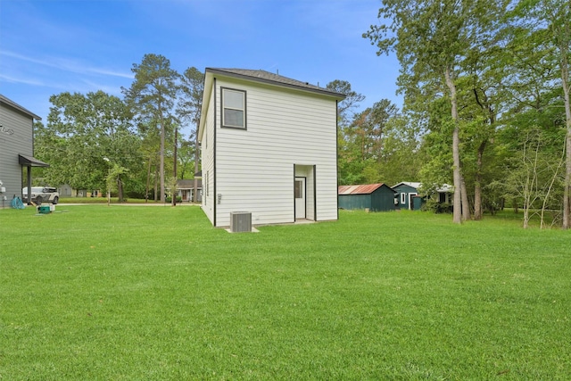 705 Little River Dr, Montgomery, TX 77316 - rear view of house featuring a lawn