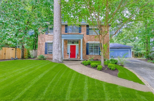 263 S Crimson Clover Ct, The Woodlands, TX 77381 - view of front of home featuring brick siding and a garage