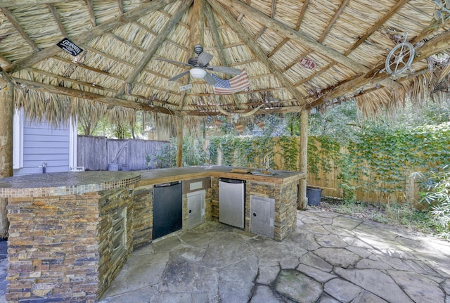 263 S Crimson Clover Ct, The Woodlands, TX 77381 - fenced backyard featuring a gazebo, area for grilling, a patio, and ceiling fan