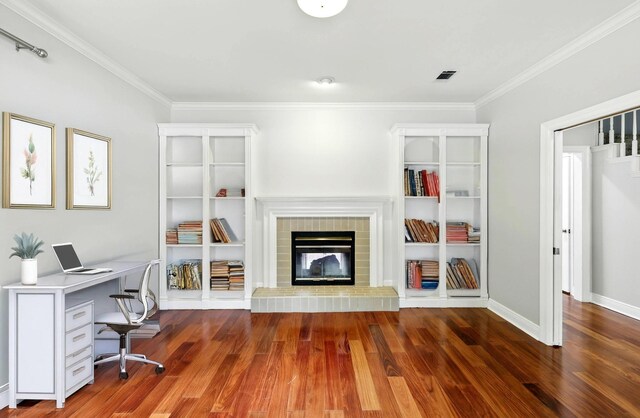 263 S Crimson Clover Ct, The Woodlands, TX 77381 - office space featuring a fireplace, wood finished floors, and crown molding