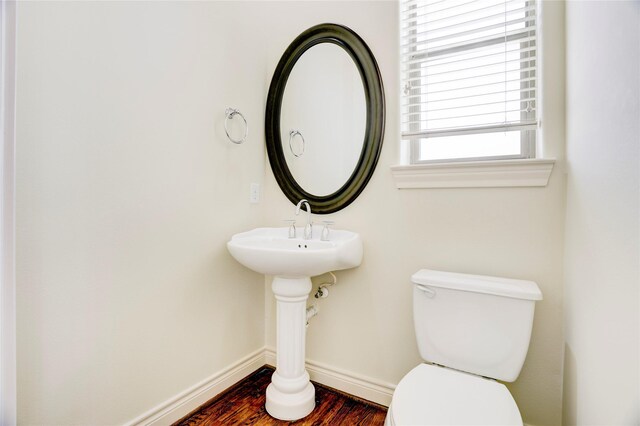 9617 Pemberton Crescent Dr, Houston, TX 77025 - bathroom featuring toilet, wood finished floors, and baseboards
