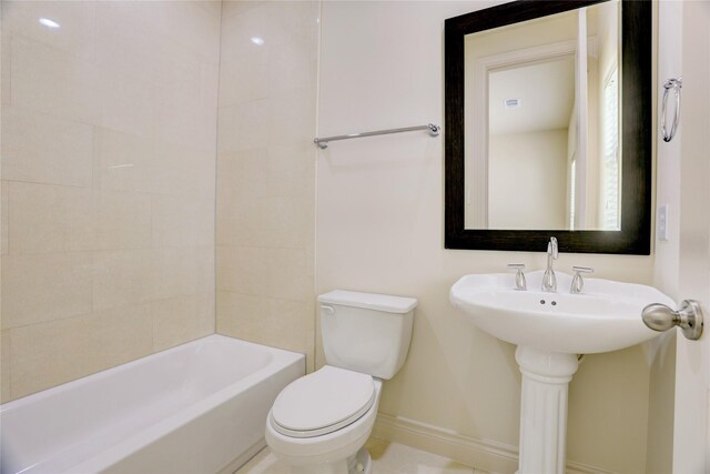 9617 Pemberton Crescent Dr, Houston, TX 77025 - bathroom featuring baseboards, toilet, and bathtub / shower combination
