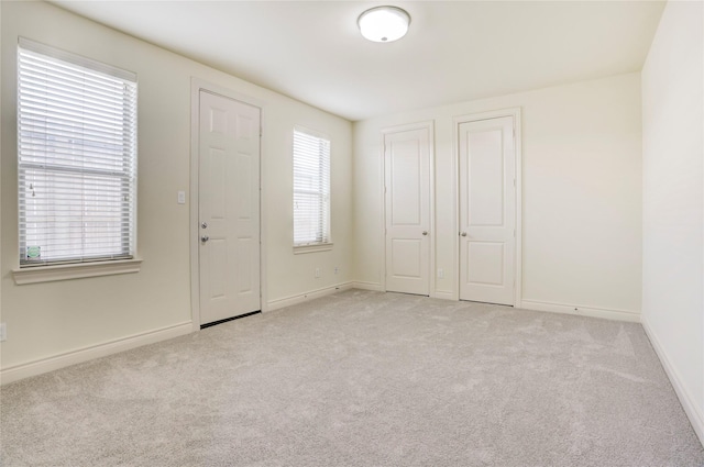 9617 Pemberton Crescent Dr, Houston, TX 77025 - foyer featuring light colored carpet and baseboards