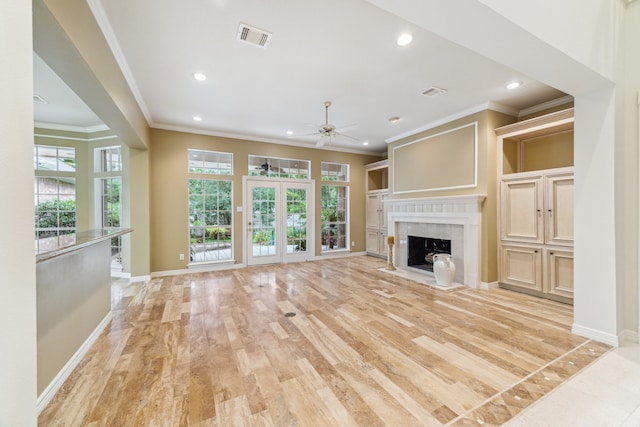 6010 Maple Knob Ct, Kingwood, TX 77345 - unfurnished living room with ceiling fan, crown molding, plenty of natural light, recessed lighting, and a fireplace