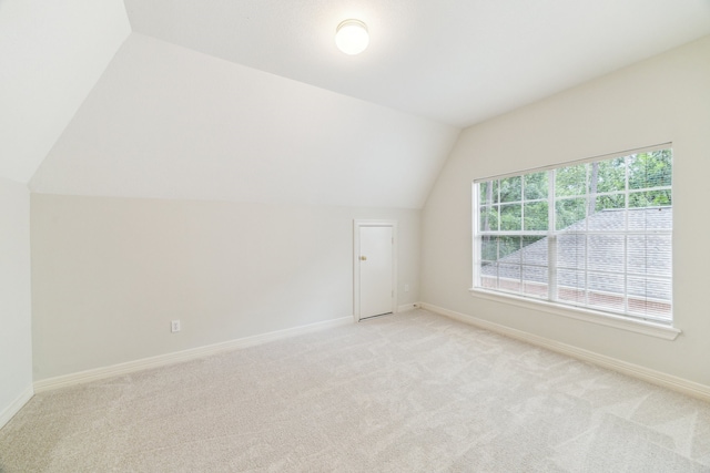 6010 Maple Knob Ct, Kingwood, TX 77345 - bonus room featuring lofted ceiling and light carpet
