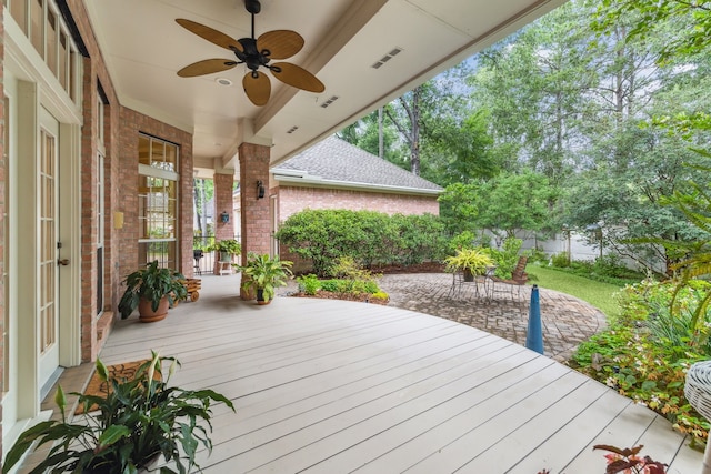 6010 Maple Knob Ct, Kingwood, TX 77345 - wooden deck with a ceiling fan and a patio area