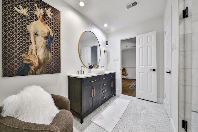 3022 Grove Terrace Dr, Houston, TX 77345 - bathroom featuring double vanity, recessed lighting, baseboards, and wood finished floors