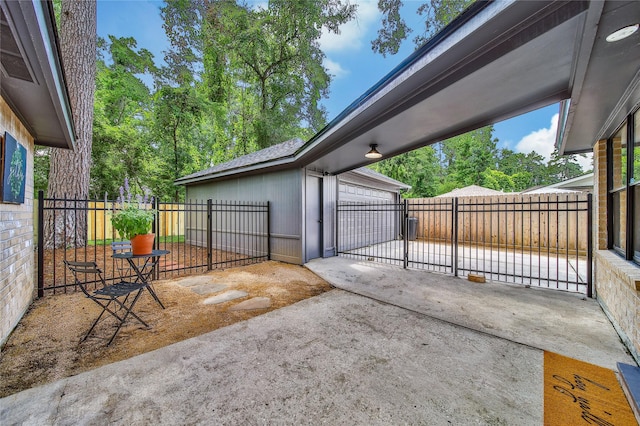 3022 Grove Terrace Dr, Houston, TX 77345 - fenced backyard with a patio, a garage, and an outdoor structure