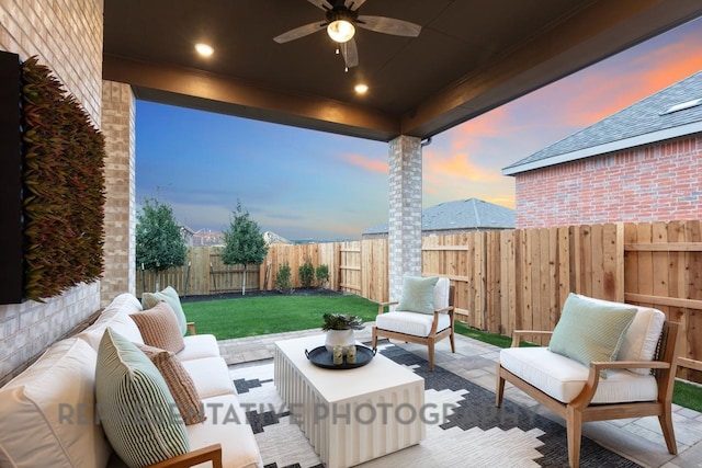 4315 Southpoint Way, Fulshear, TX 77441 - patio terrace at dusk with outdoor lounge area, a fenced backyard, ceiling fan, and a patio area