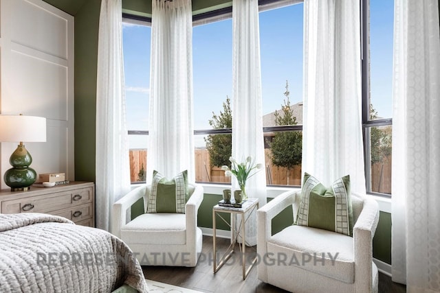 4315 Southpoint Way, Fulshear, TX 77441 - bedroom featuring multiple windows and wood finished floors