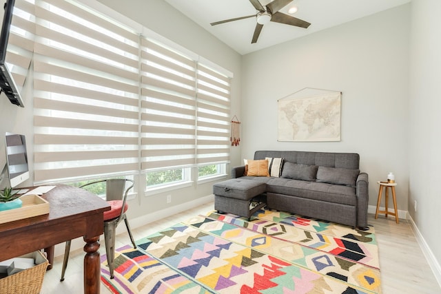 9715 Highland Pointe Dr, Needville, TX 77461 - living room with ceiling fan, baseboards, and light wood-type flooring
