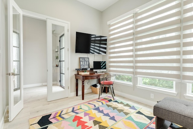 9715 Highland Pointe Dr, Needville, TX 77461 - office area featuring french doors, baseboards, and wood finished floors