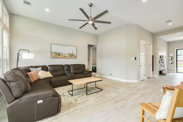9715 Highland Pointe Dr, Needville, TX 77461 - living room with light wood-style floors, ceiling fan, baseboards, and recessed lighting