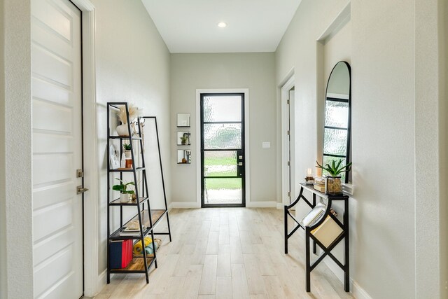 9715 Highland Pointe Dr, Needville, TX 77461 - foyer featuring light wood-style floors and baseboards