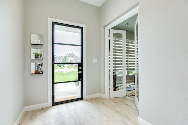 9715 Highland Pointe Dr, Needville, TX 77461 - doorway to outside featuring wood finished floors and baseboards