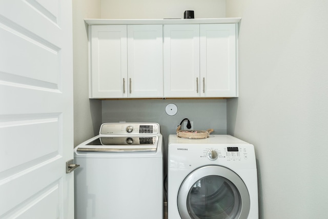 9715 Highland Pointe Dr, Needville, TX 77461 - laundry room with washing machine and dryer and cabinet space