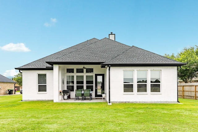 9715 Highland Pointe Dr, Needville, TX 77461 - rear view of property with brick siding, a patio area, a shingled roof, and a chimney