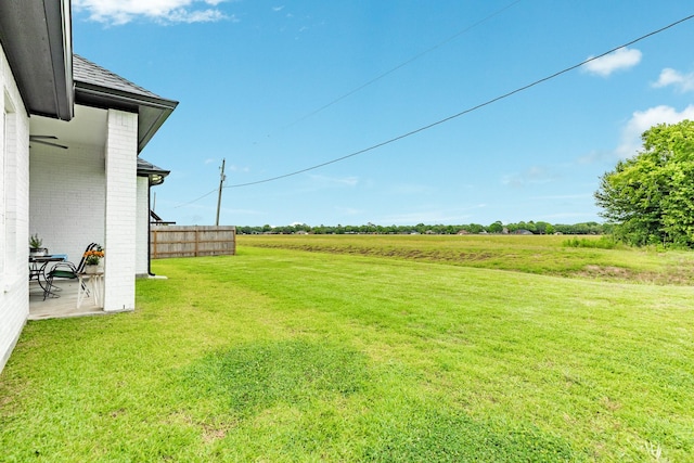 9715 Highland Pointe Dr, Needville, TX 77461 - view of yard with a patio and a view of rural / pastoral area