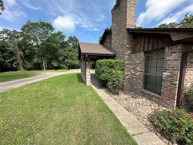 113 Fm 3454th Rd, Huntsville, TX 77320 - view of home's exterior featuring a lawn and a chimney