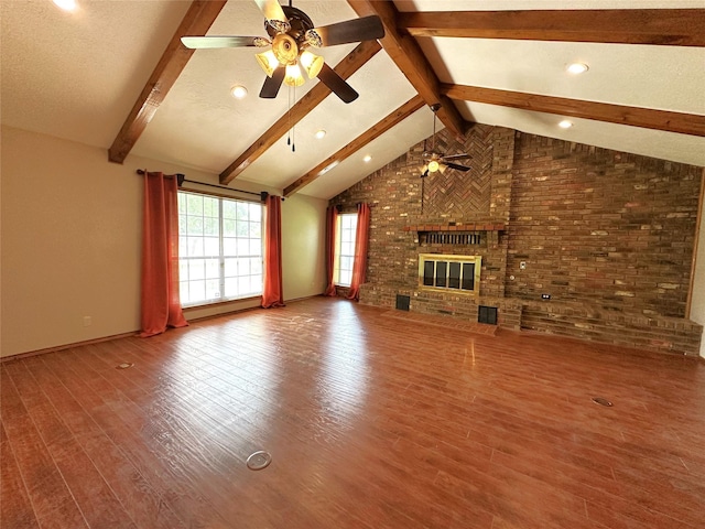 113 Fm 3454th Rd, Huntsville, TX 77320 - unfurnished living room with ceiling fan, wood finished floors, brick wall, a fireplace, and baseboards