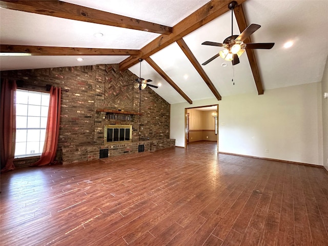 113 Fm 3454th Rd, Huntsville, TX 77320 - unfurnished living room with a ceiling fan, beam ceiling, baseboards, wood finished floors, and high vaulted ceiling
