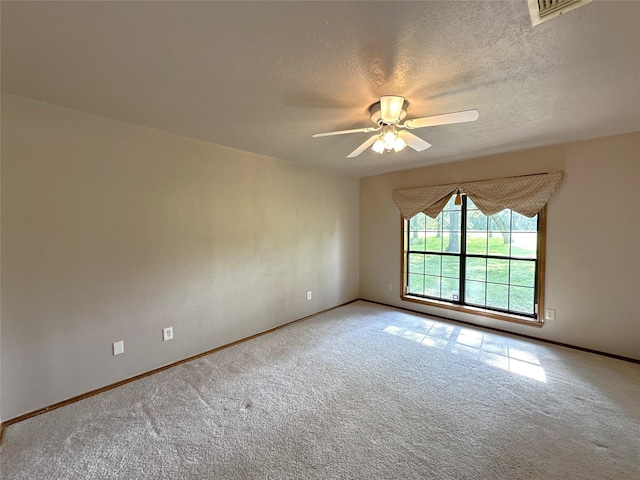 113 Fm 3454th Rd, Huntsville, TX 77320 - carpeted spare room featuring ceiling fan, baseboards, and a textured ceiling