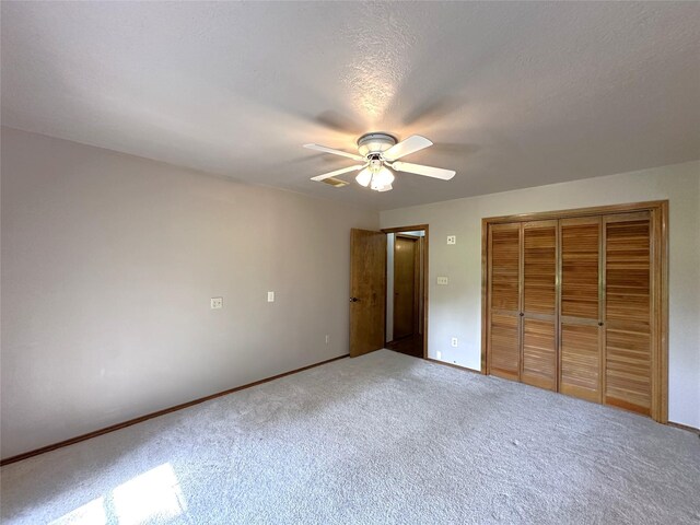113 Fm 3454th Rd, Huntsville, TX 77320 - unfurnished bedroom featuring carpet floors, a closet, ceiling fan, and baseboards