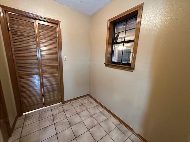 113 Fm 3454th Rd, Huntsville, TX 77320 - unfurnished room featuring baseboards and light tile patterned flooring
