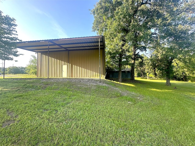 113 Fm 3454th Rd, Huntsville, TX 77320 - view of green lawn with an outdoor structure and a pole building