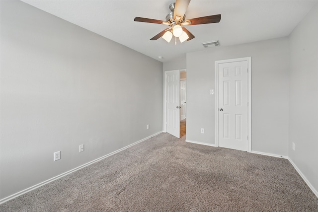 6419 Bonnie Chase Ln, Katy, TX 77449 - unfurnished bedroom with baseboards, carpet flooring, and ceiling fan