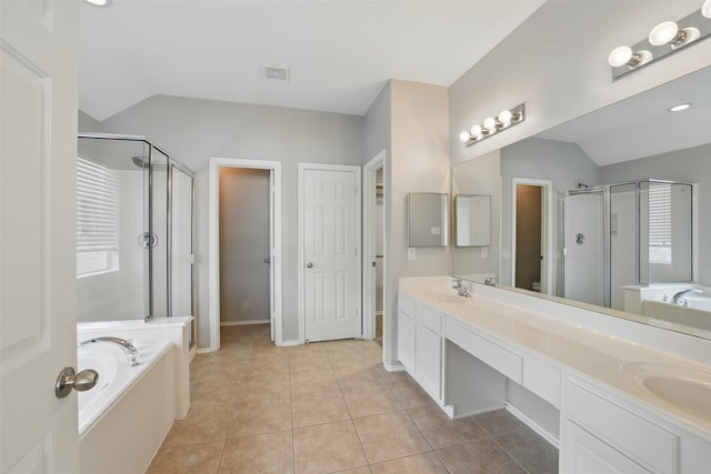 6419 Bonnie Chase Ln, Katy, TX 77449 - full bathroom with lofted ceiling, a stall shower, a bath, double vanity, and tile patterned flooring
