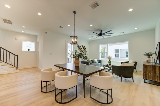 4045 Buck St, Houston, TX 77020 - dining room with light wood-type flooring, stairway, recessed lighting, baseboards, and a ceiling fan