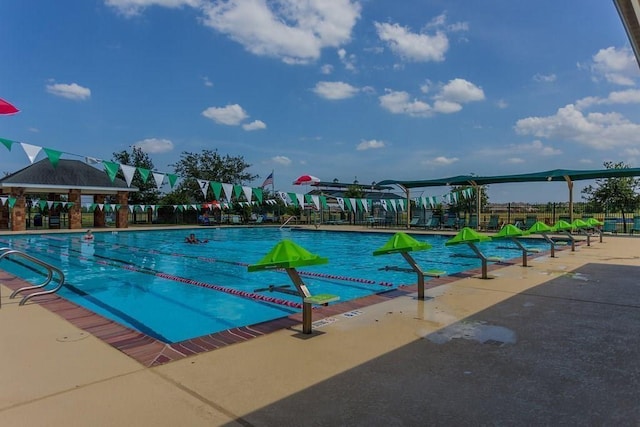 1234 Walston Ridge Dr, Spring, TX 77379 - community pool featuring a patio