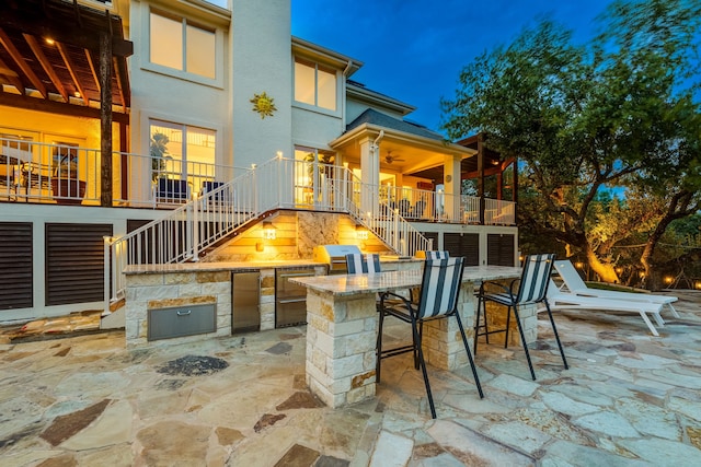 4315 Lago Viento, Austin, TX 78734 - view of patio featuring stairway and exterior kitchen