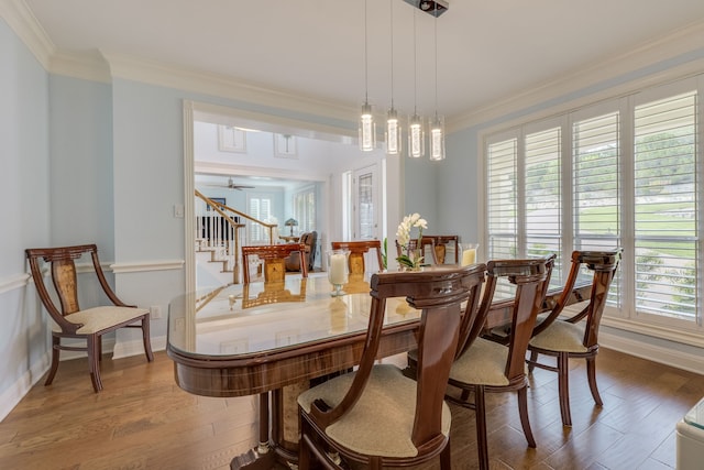 4315 Lago Viento, Austin, TX 78734 - dining area featuring stairway, wood finished floors, ornamental molding, baseboards, and a ceiling fan