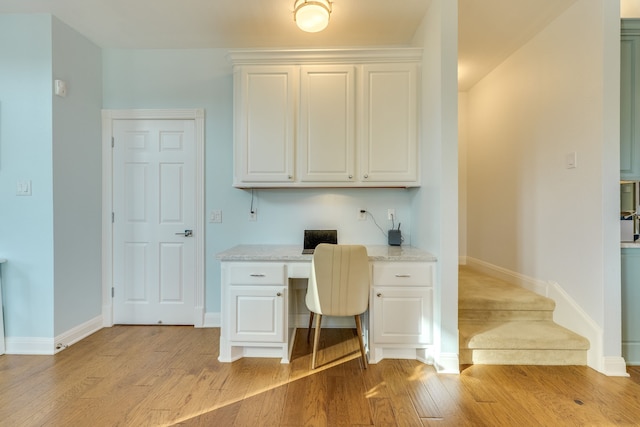 4315 Lago Viento, Austin, TX 78734 - office area featuring built in desk, light wood-style flooring, and baseboards