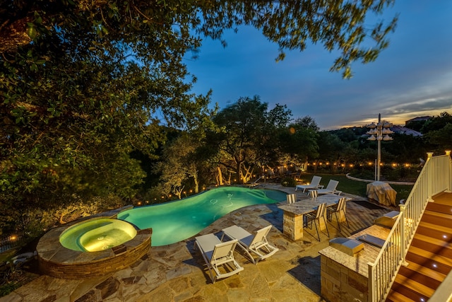 4315 Lago Viento, Austin, TX 78734 - pool at dusk with a patio area and a pool with connected hot tub