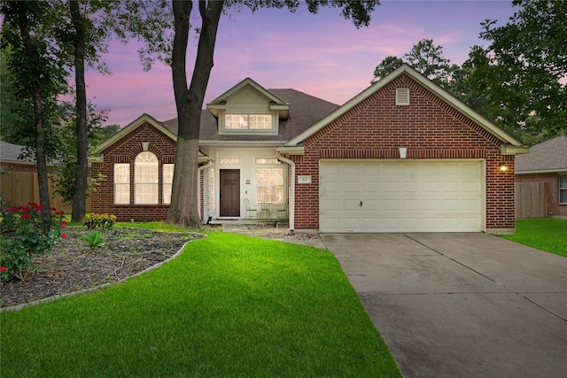 23 Drifting Shadows Cir, Conroe, TX 77385 - traditional home featuring brick siding, driveway, a garage, and a shingled roof