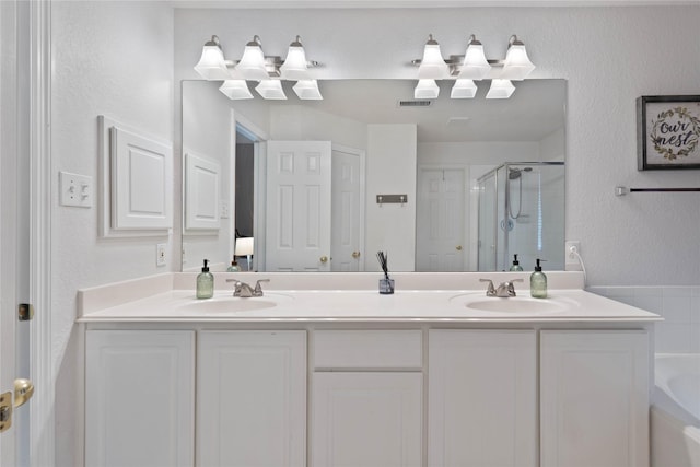 23 Drifting Shadows Cir, Conroe, TX 77385 - full bath with a stall shower, double vanity, and a bath