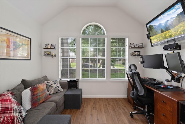 23 Drifting Shadows Cir, Conroe, TX 77385 - home office with healthy amount of natural light, light wood-style floors, vaulted ceiling, and baseboards