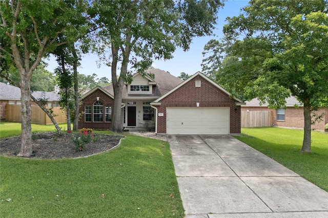 23 Drifting Shadows Cir, Conroe, TX 77385 - traditional-style home featuring brick siding, a garage, and concrete driveway