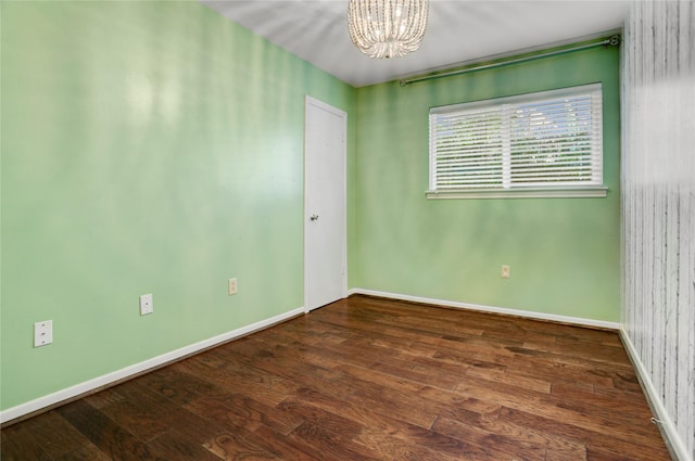 9327 Fairdale Ln, Houston, TX 77063 - empty room featuring a chandelier, wood finished floors, and baseboards