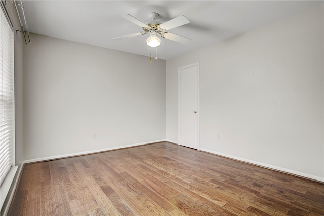 9327 Fairdale Ln, Houston, TX 77063 - unfurnished room with wood finished floors, baseboards, and a ceiling fan