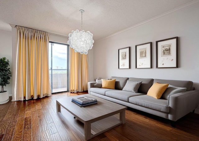 651 Bering Dr Unit 1101, Houston, TX 77057 - living room with crown molding, a chandelier, dark wood-type flooring, and a textured ceiling