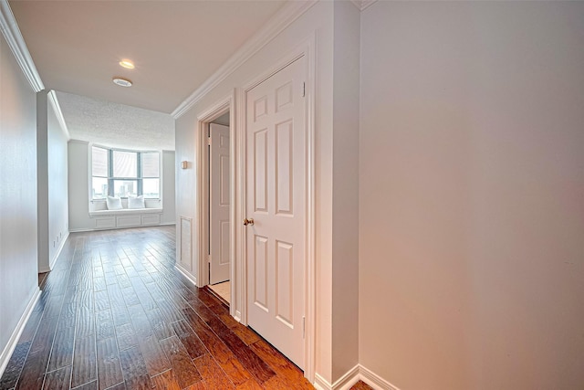 651 Bering Dr Unit 1101, Houston, TX 77057 - hall featuring crown molding, dark wood-style flooring, and baseboards