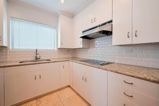 651 Bering Dr Unit 1101, Houston, TX 77057 - kitchen with under cabinet range hood, a sink, black electric cooktop, ornamental molding, and backsplash