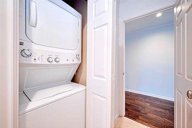 651 Bering Dr Unit 1101, Houston, TX 77057 - laundry room with stacked washer / drying machine and baseboards