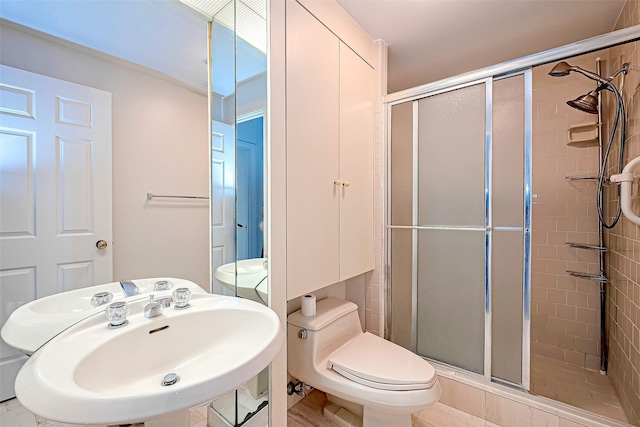 651 Bering Dr Unit 1101, Houston, TX 77057 - full bath with a stall shower, a sink, and toilet
